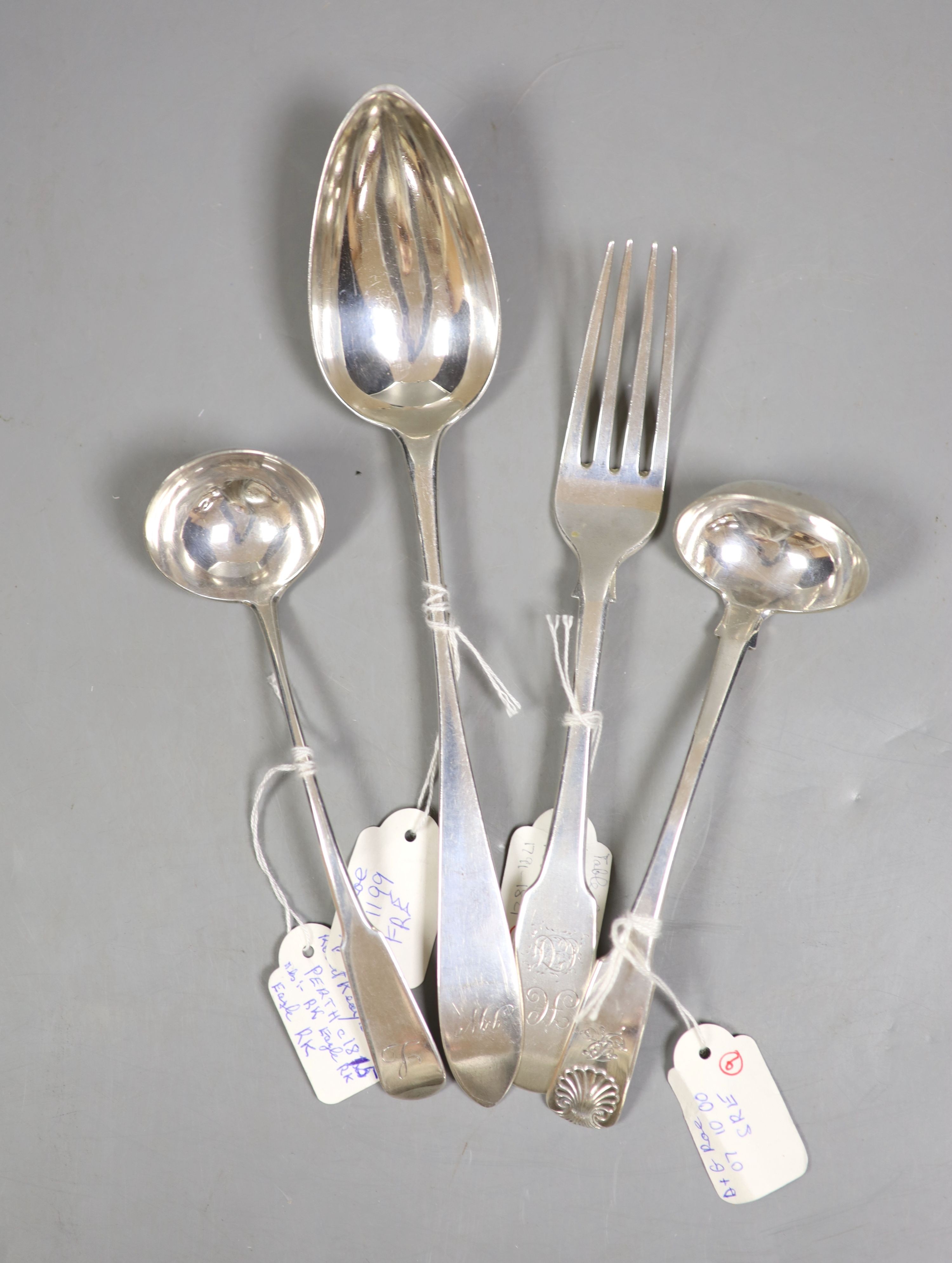 A 19th century Scottish provincial silver Celtic tip tablespoon, 23.5cm, c.1790, a fiddle pattern table fork and fiddle pattern toddy ladle, by Robert Keay, Perth, c.1830 and a fiddle and shall pattern toddy ladle, Charl